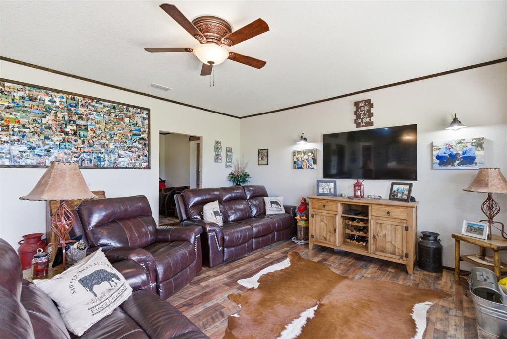 8315 County Road 403 Cisco, TX 76437 - Photo 25 of 40 a living room with furniture and a flat screen tv