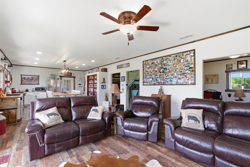 8315 County Road 403 Cisco, TX 76437 - Photo 26 of 40 a living room with furniture and a ceiling fan