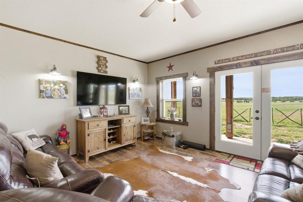 8315 County Road 403 Cisco, TX 76437 - Photo 27 of 40 a living room with furniture and a flat screen tv