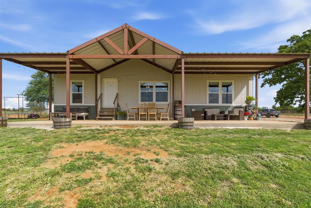 8315 County Road 403 Cisco, TX 76437 - Photo 5 of 40 a front view of a house with a yard