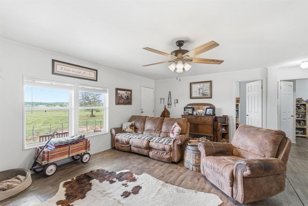 8315 County Road 403 Cisco, TX 76437 - Photo 7 of 40 a living room with furniture and a large window