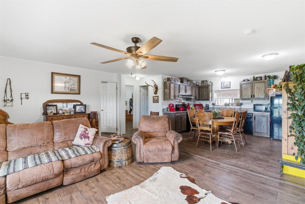 8315 County Road 403 Cisco, TX 76437 - Photo 8 of 40 a living room with furniture and kitchen view