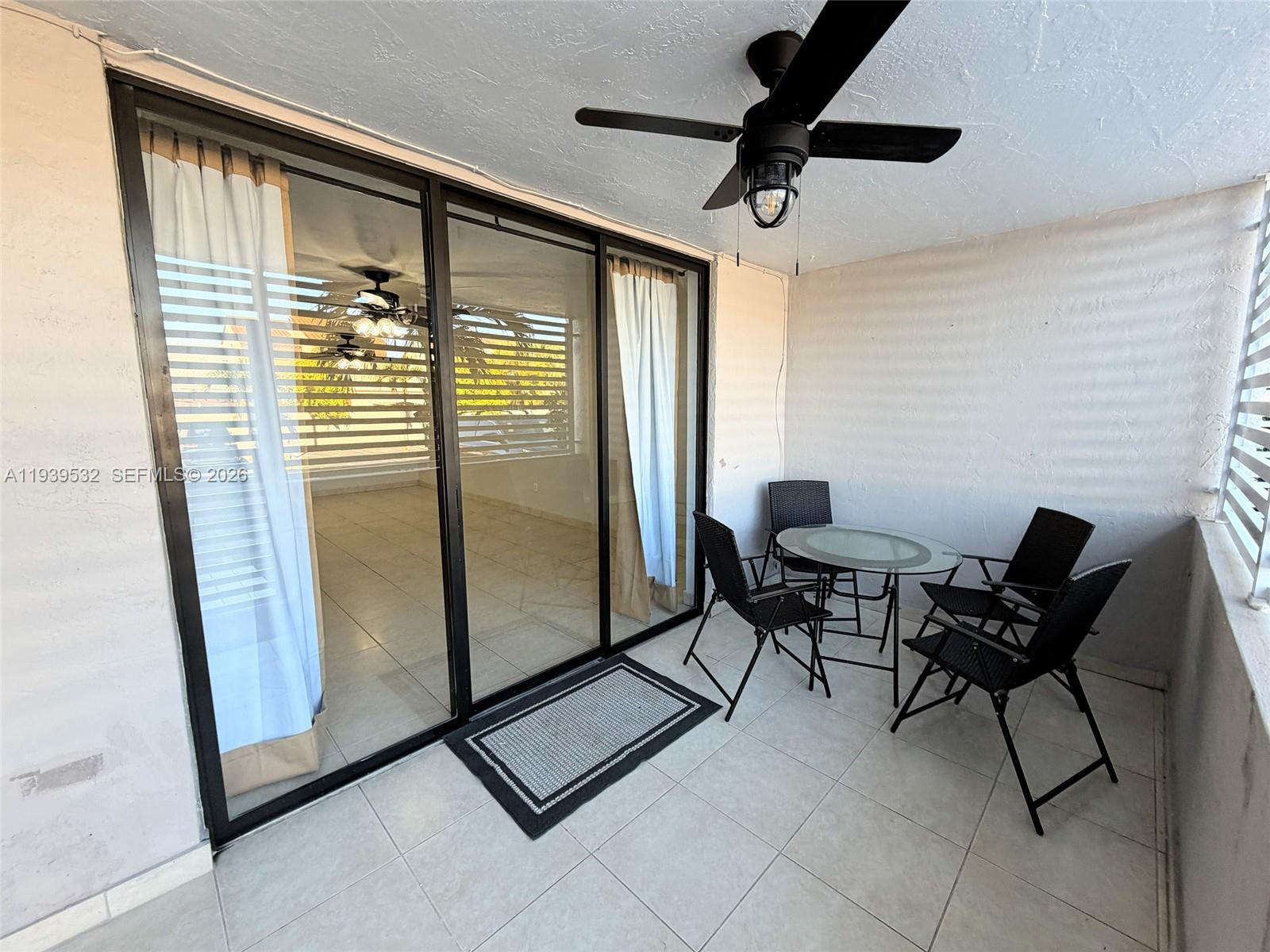 11755 Southwest 18th Street, Unit 109 Miami, FL 33175 - Photo 18 of 21 a view of a room with furniture and a window