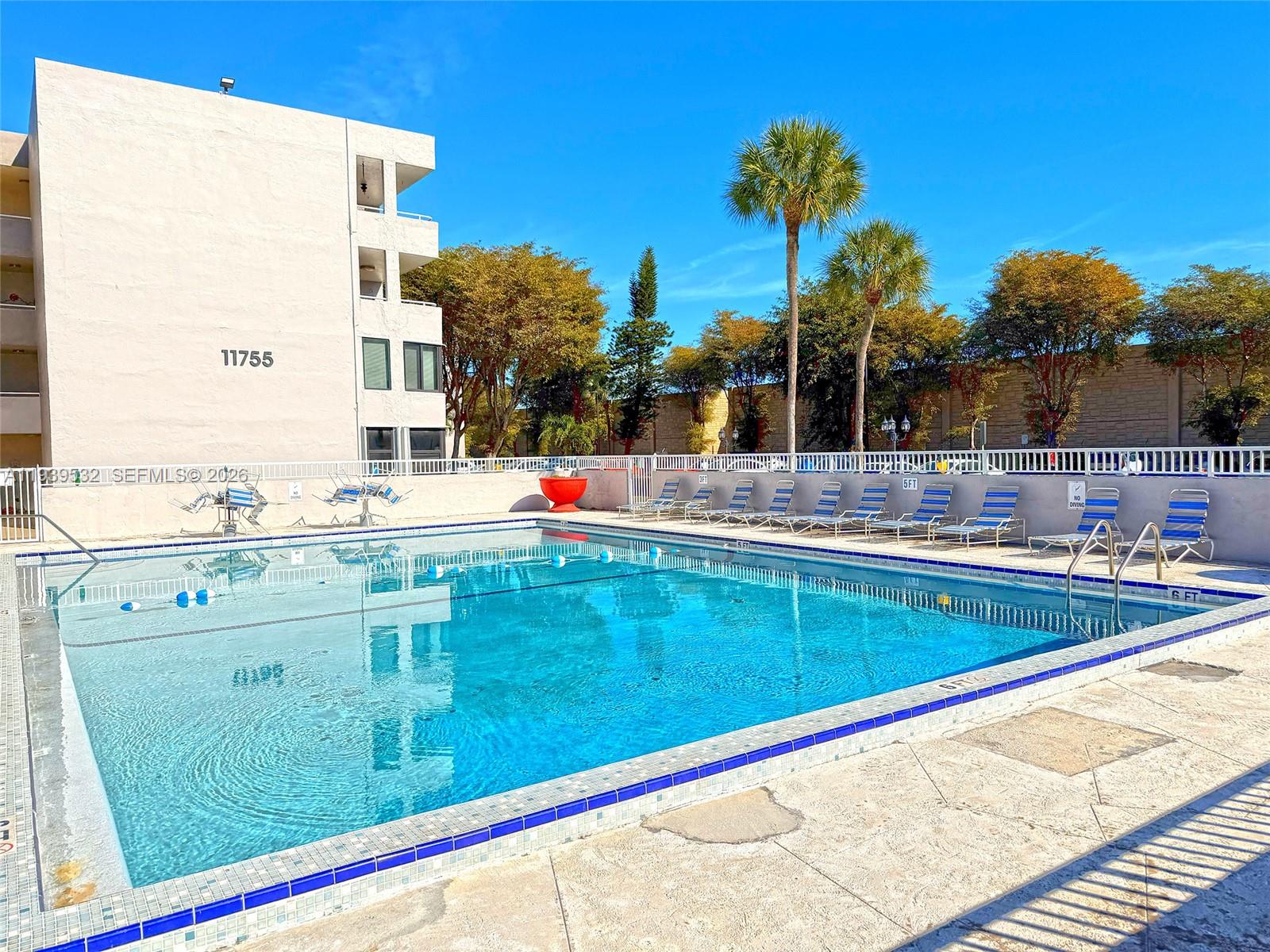 11755 Southwest 18th Street, Unit 109 Miami, FL 33175 - Photo 20 of 21 swimming pool view with a outdoor space
