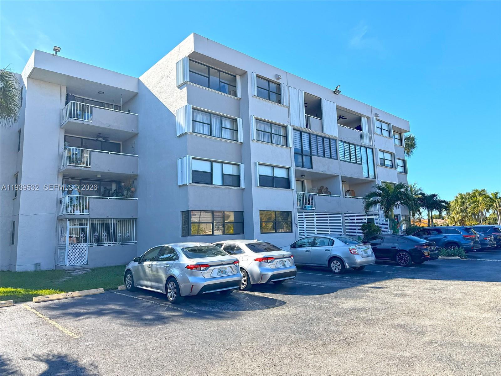 11755 Southwest 18th Street, Unit 109 Miami, FL 33175 - Photo 21 of 21 a car parked in front of a building