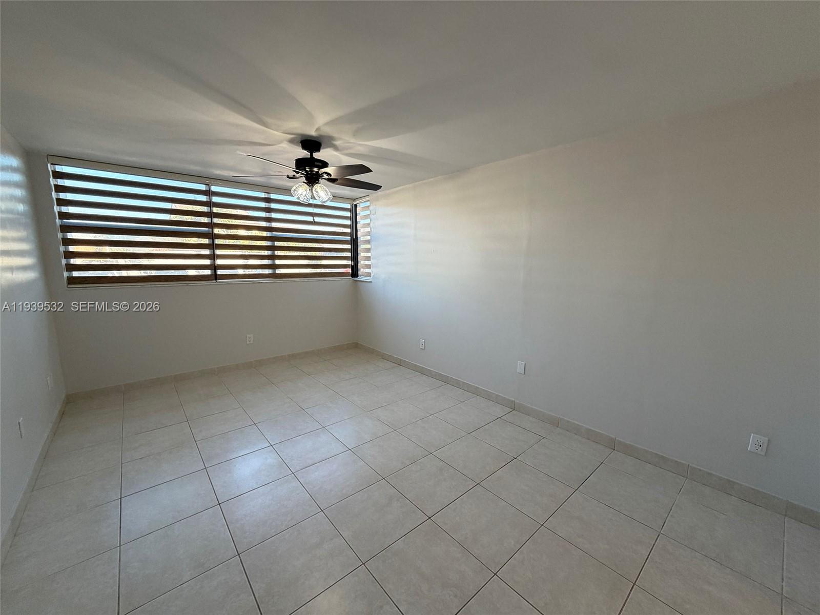 11755 Southwest 18th Street, Unit 109 Miami, FL 33175 - Photo 7 of 21 a view of an empty room with a window