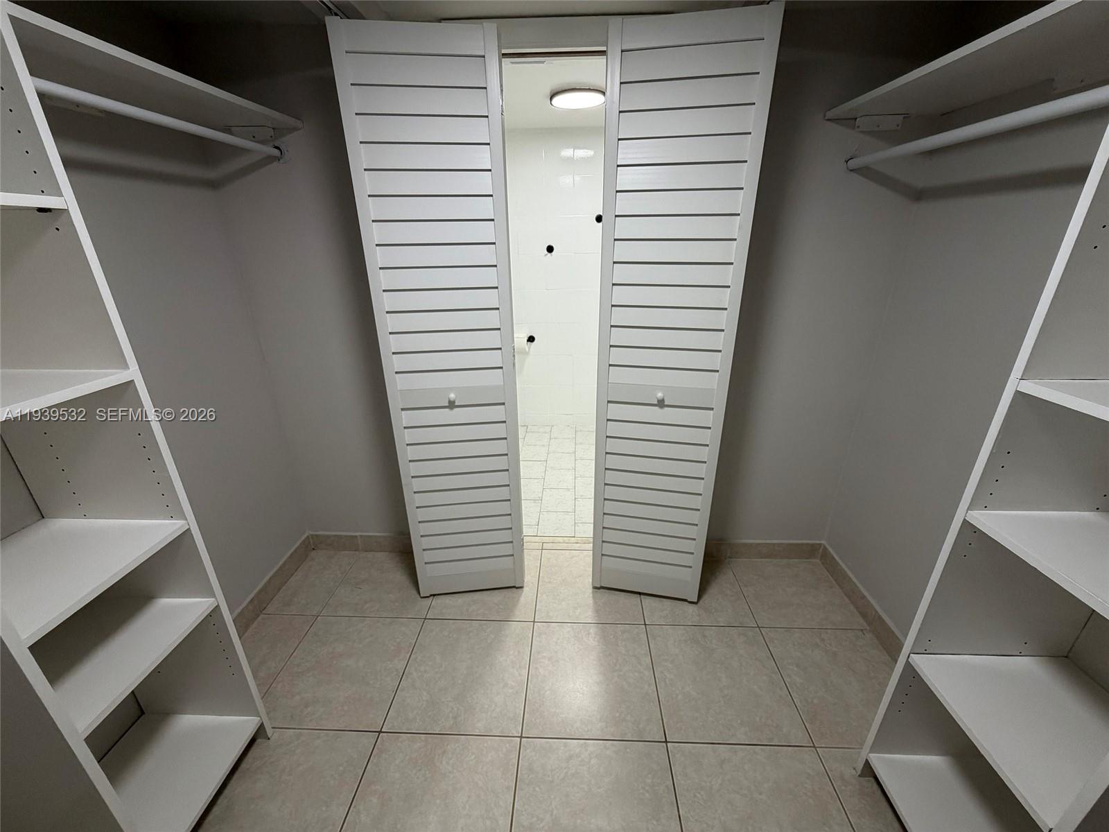 11755 Southwest 18th Street, Unit 109 Miami, FL 33175 - Photo 10 of 21 a view of entryway with stairs and a window