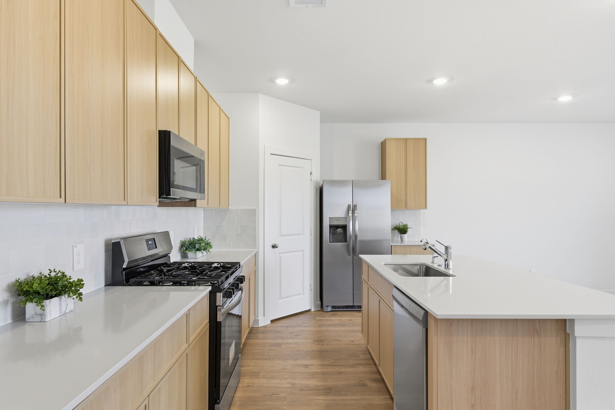 3534 Blue Mockingbird Street Katy, TX 77494 - Photo 2 of 39 The practical and functional kitchen was designed for the home chef in mind, big kitchen island, stainless steel appliances, plenty of countertops, and cabinet space, ideal for making memorable meals for family and friends.