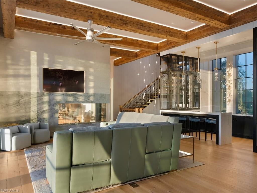 7409 Bay Colony Drive Naples, FL 34108 - Photo 11 of 48 a view of kitchen with dining room and wooden floor