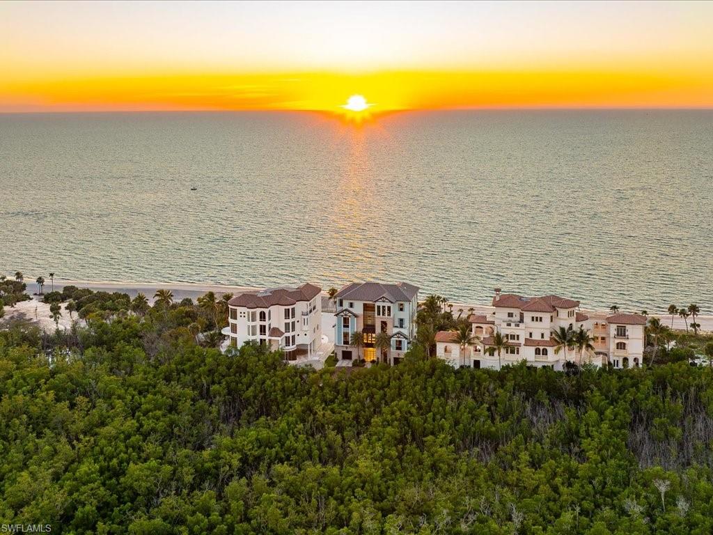 7409 Bay Colony Drive Naples, FL 34108 - Photo 14 of 48 a view of an ocean and beach