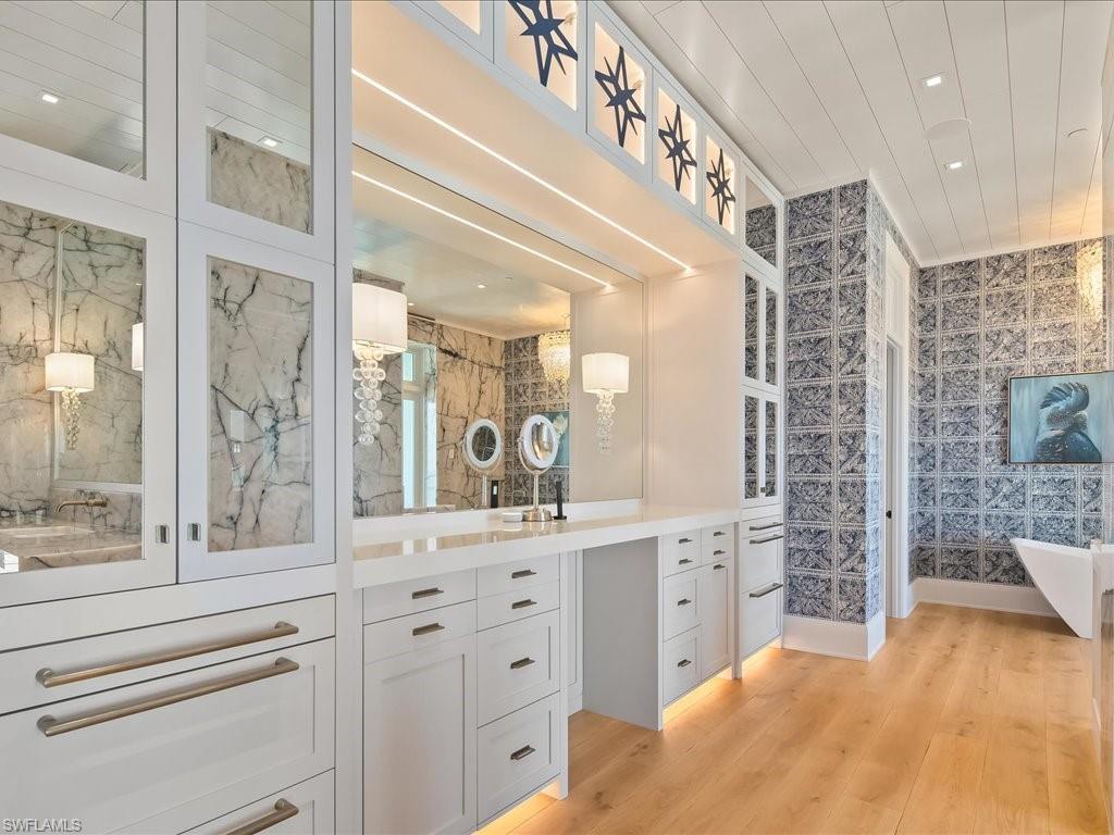 7409 Bay Colony Drive Naples, FL 34108 - Photo 26 of 46 Full bath with vanity, recessed lighting, light wood-style floors, and a soaking tub