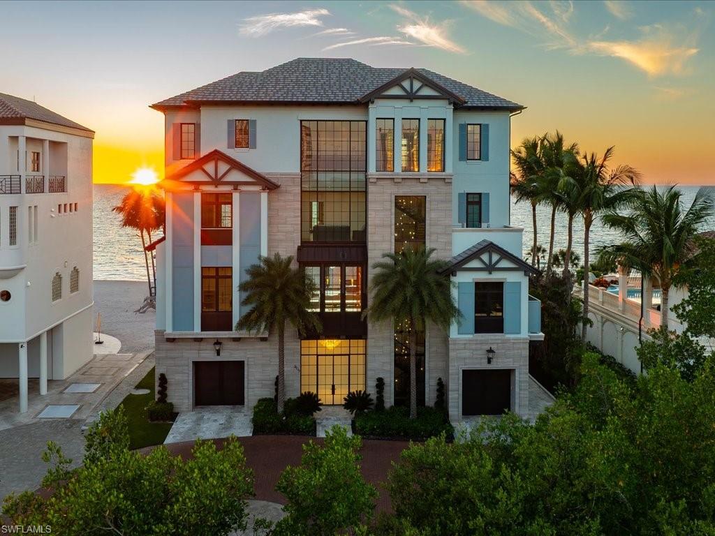 7409 Bay Colony Drive Naples, FL 34108 - Photo 44 of 46 View of front of home with stone siding and a shingled roof