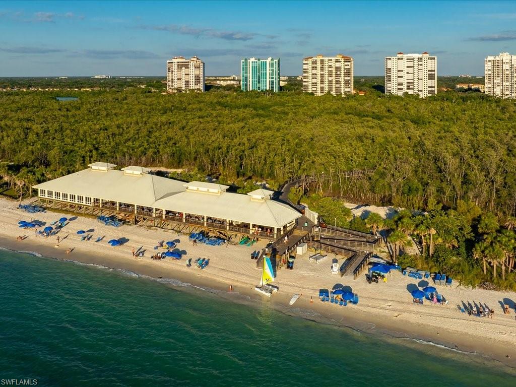 7409 Bay Colony Drive Naples, FL 34108 - Photo 46 of 46 Drone / aerial view of a heavily wooded area and expansive beach