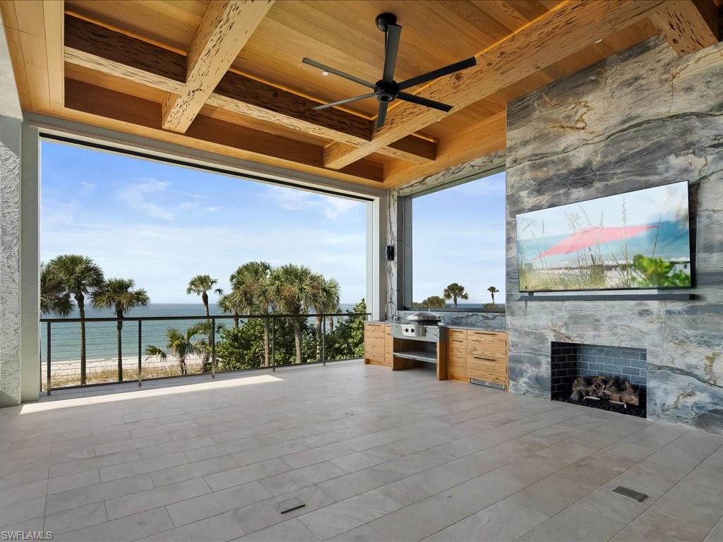 7409 Bay Colony Drive Naples, FL 34108 - Photo 7 of 46 View of patio / terrace featuring an outdoor kitchen and a ceiling fan