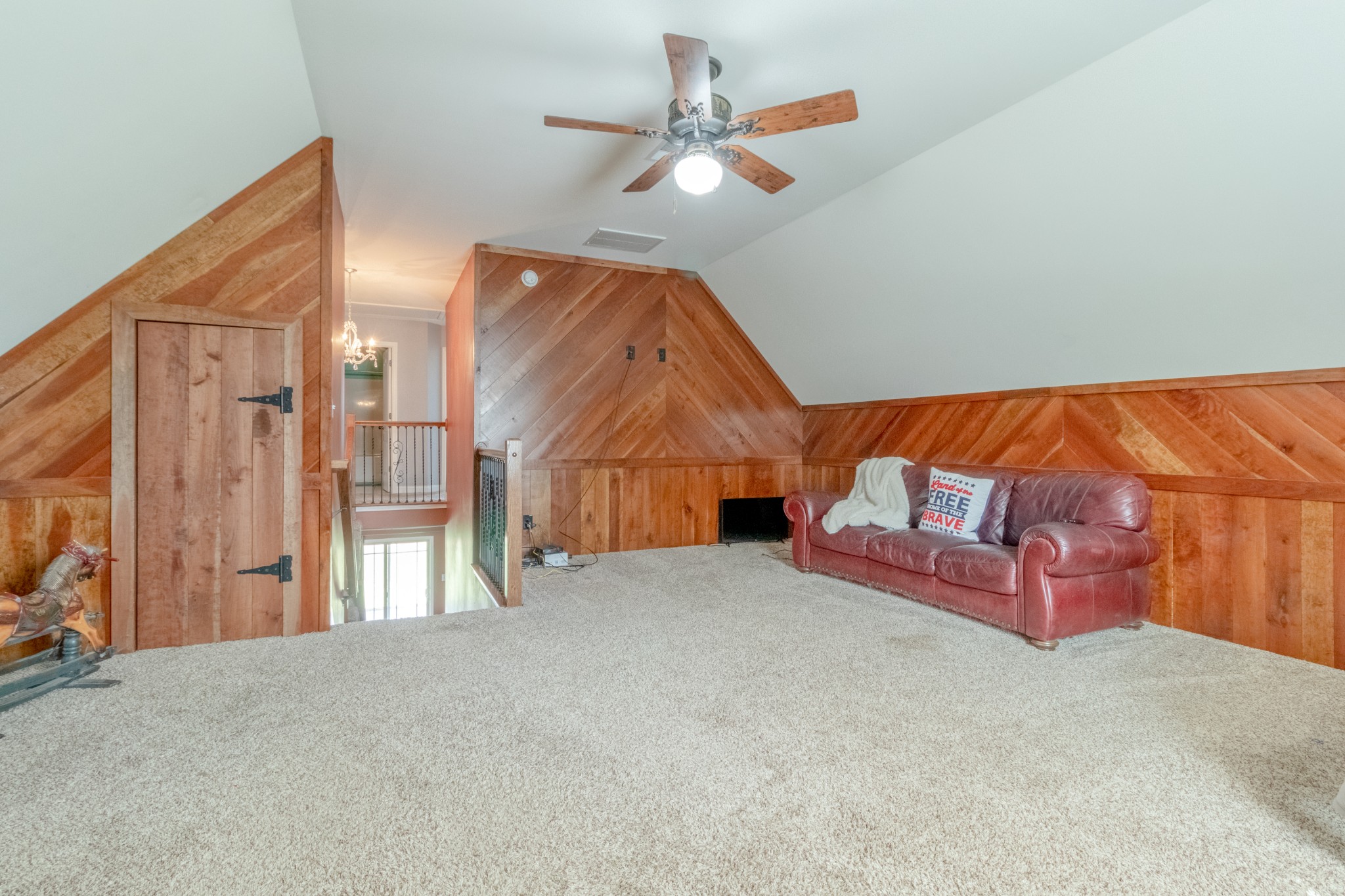 280 Harper Road Clarksville, TN 37043 - Photo 19 of 23 a view of a livingroom with wooden floor and a ceiling fan