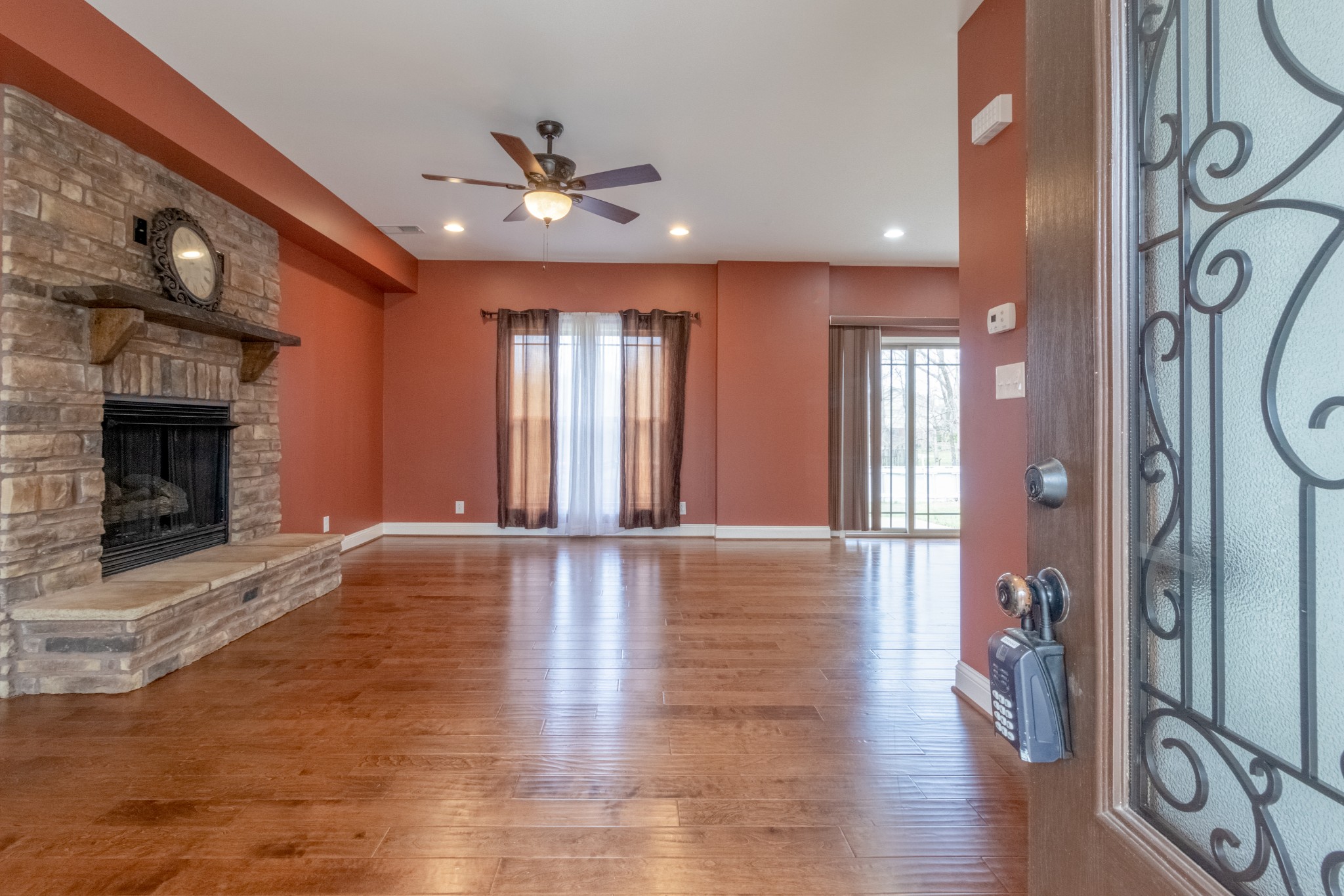 280 Harper Road Clarksville, TN 37043 - Photo 3 of 23 a view of an empty room with window and wooden floor