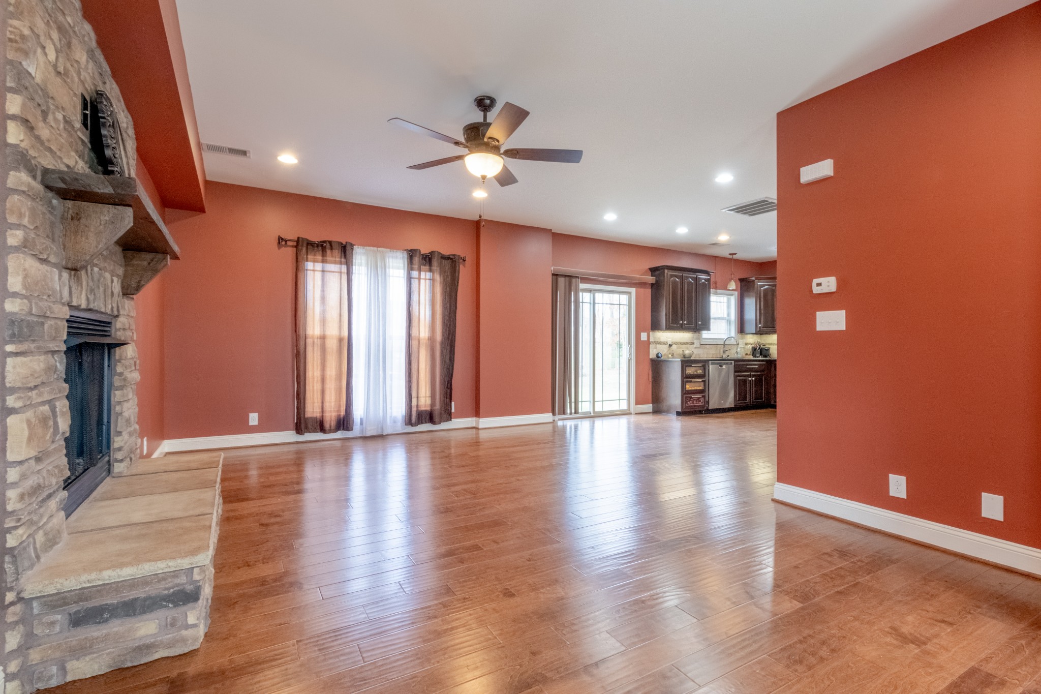 280 Harper Road Clarksville, TN 37043 - Photo 4 of 23 a view of an empty room with window and wooden floor