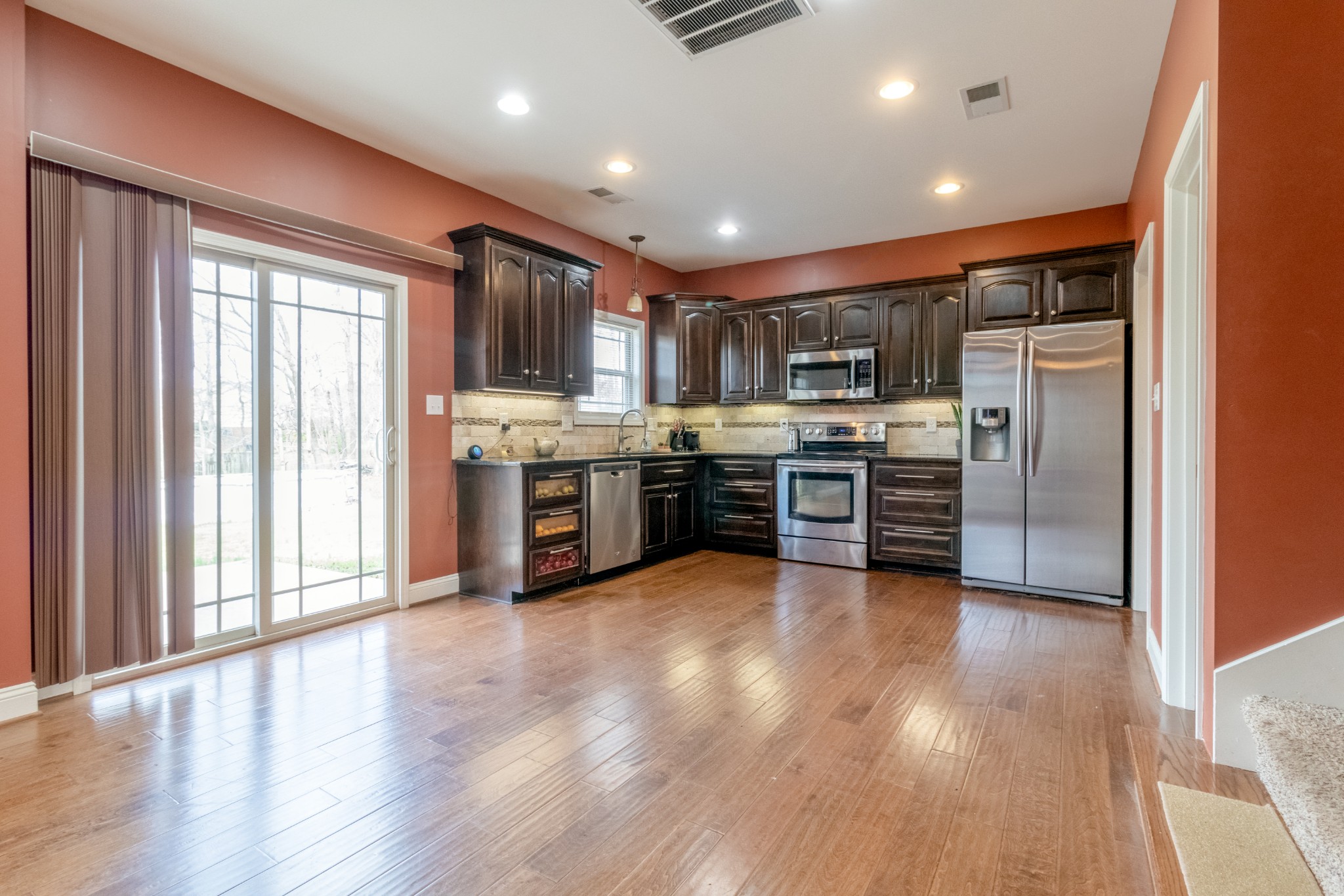 280 Harper Road Clarksville, TN 37043 - Photo 7 of 23 a large kitchen with stainless steel appliances granite countertop a stove and a refrigerator