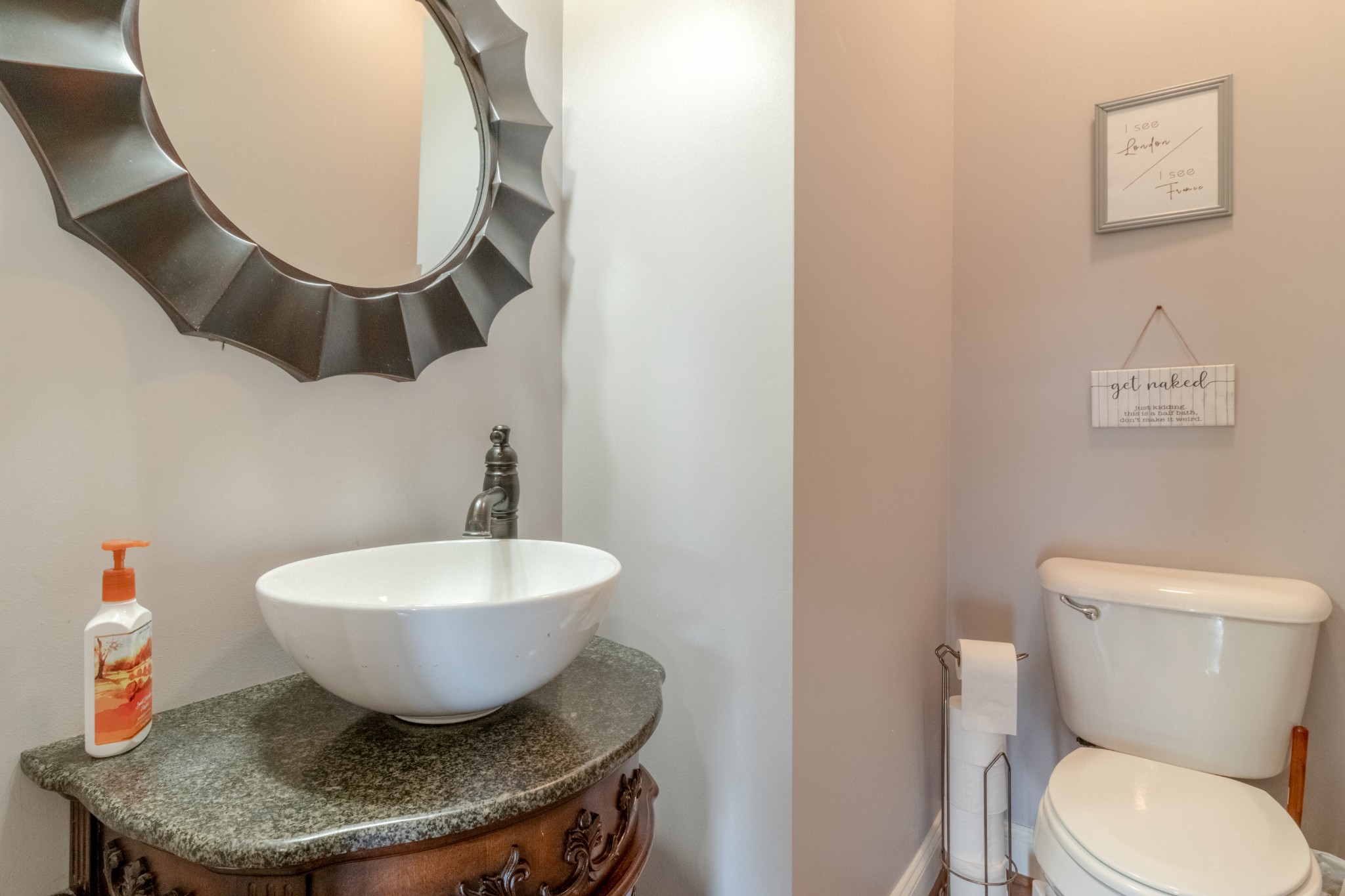 280 Harper Road Clarksville, TN 37043 - Photo 9 of 23 a bathroom with a toilet a sink and a mirror