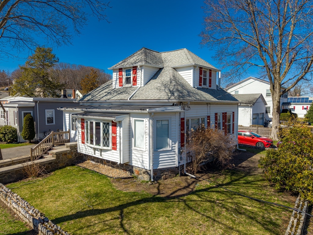 10 Guild Road Saugus, MA 01906 - Photo 2 of 32 a front view of house with yard and trees around