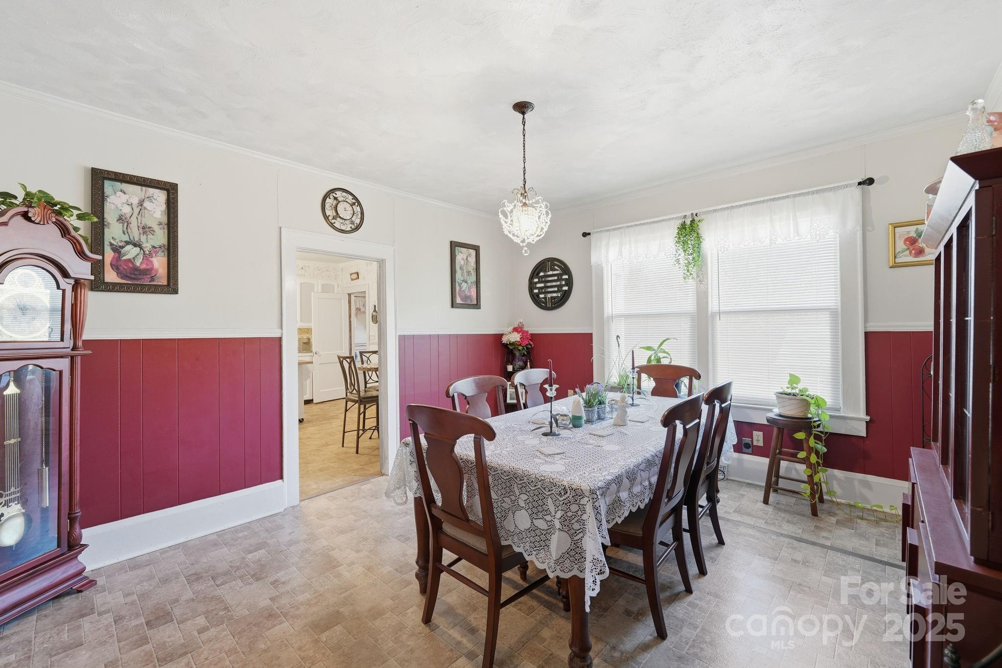 105 1st Street Rockingham, NC 28379 - Photo 13 of 28 a view of a dining room with furniture and a chandelier