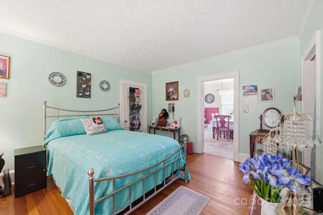 a bedroom with a bed and a table