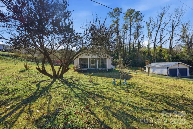 a house with swimming pool in front of it