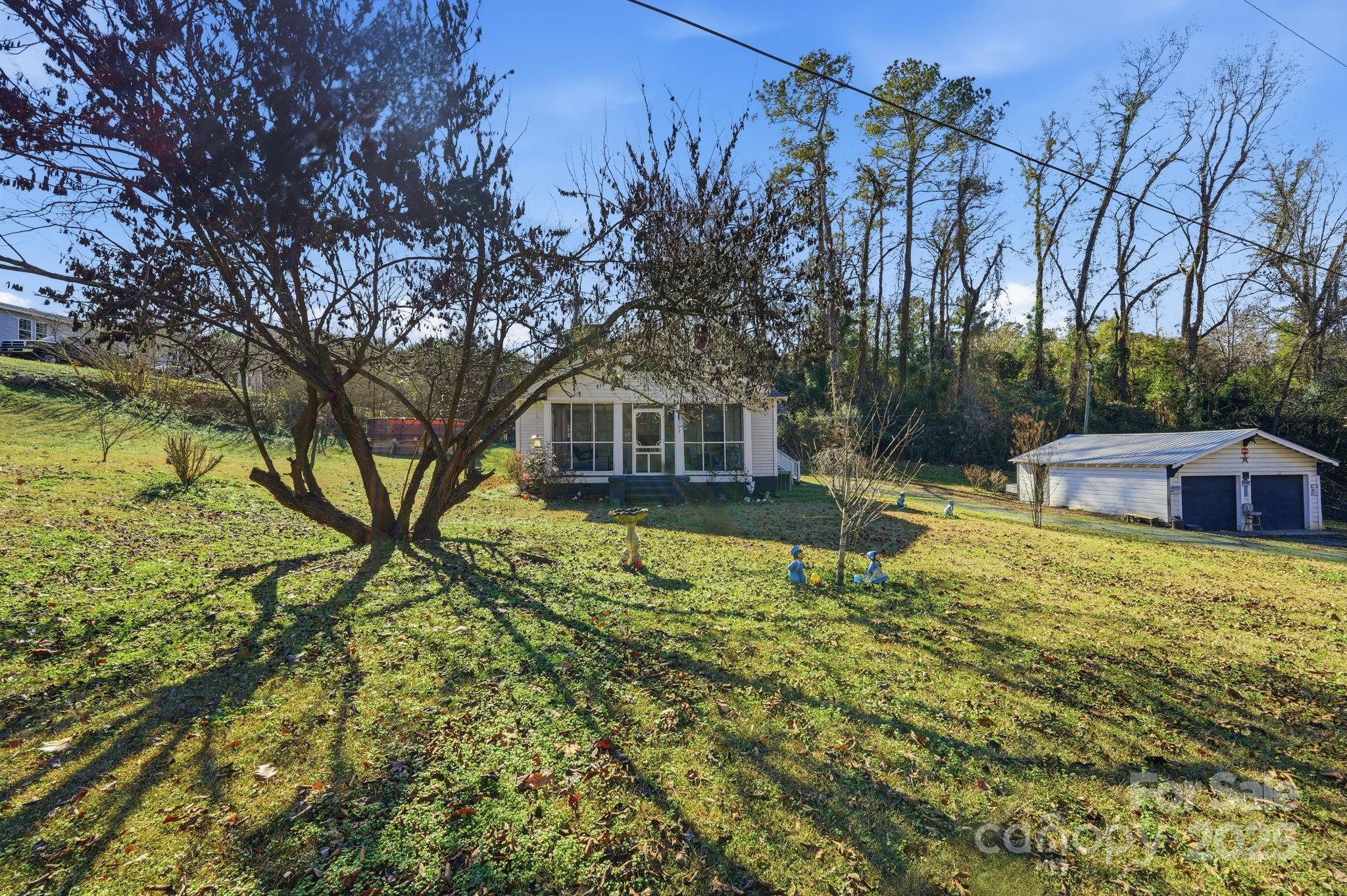 105 1st Street Rockingham, NC 28379 - Photo 3 of 28 a house with swimming pool in front of it