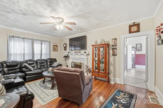 a living room with furniture fireplace and flat screen tv