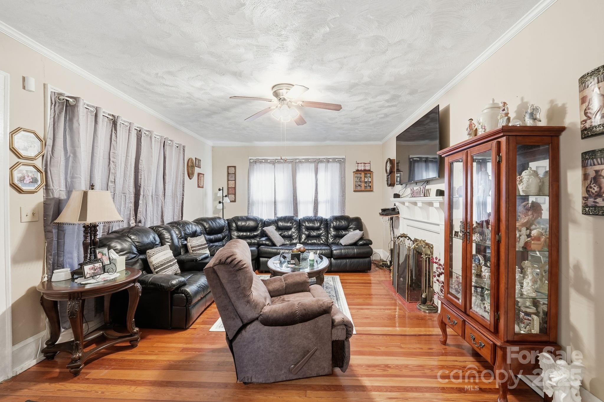 105 1st Street Rockingham, NC 28379 - Photo 6 of 28 a living room with furniture fireplace and a window