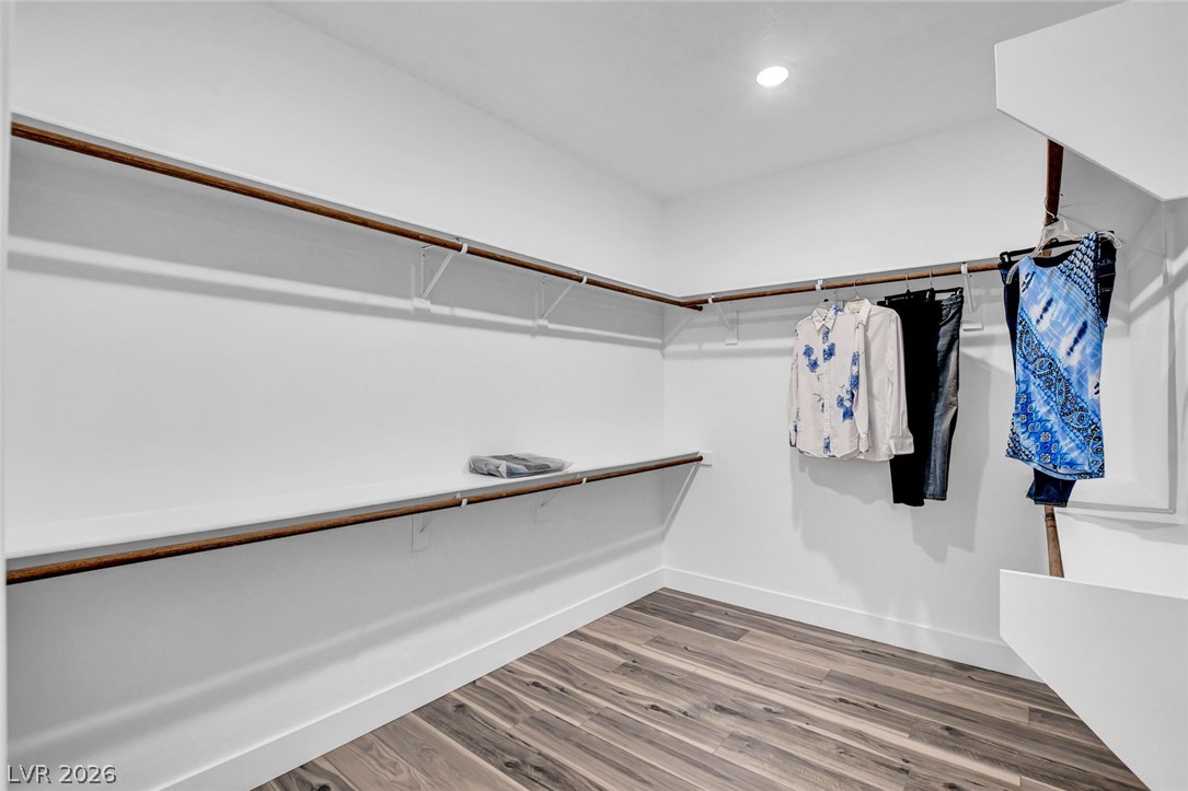 9688 Rankin Rdg Court Las Vegas, NV 89178 - Photo 37 of 53 Walk-in closet offers extensive shelving and hanging space on beautiful wood-look flooring.