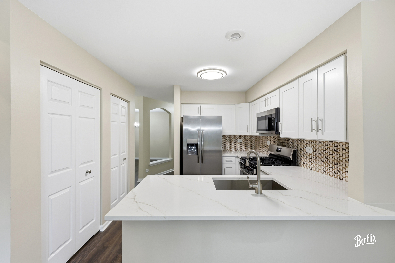 728 Old Checker Road Buffalo Grove, IL 60089 - Photo 5 of 22 a kitchen with stainless steel appliances a sink a stove a refrigerator cabinets and a dining table