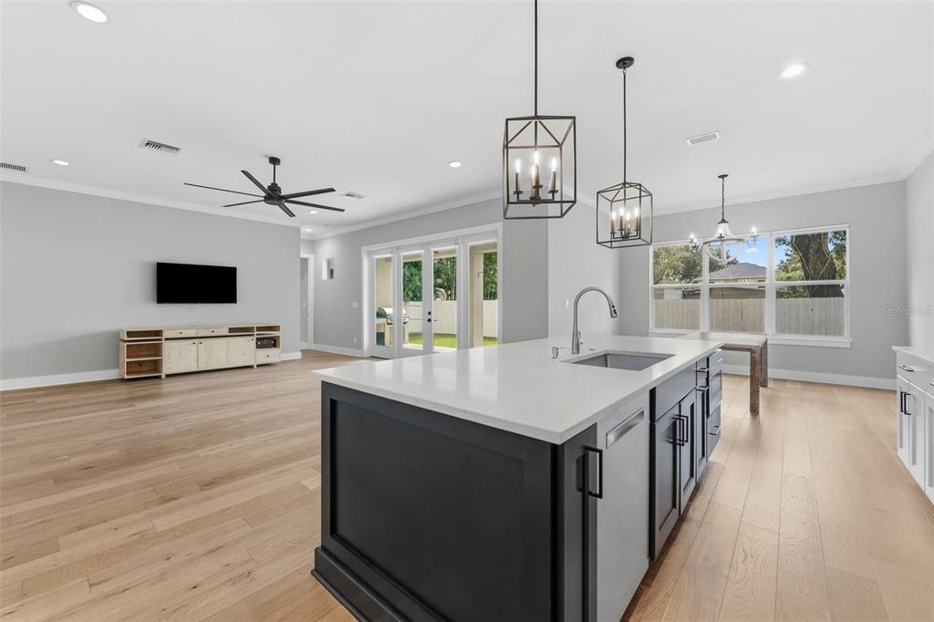 3314 West Villa Rosa Street Tampa, FL 33611 - Photo 11 of 55 a kitchen with stainless steel appliances kitchen island a large island in the center