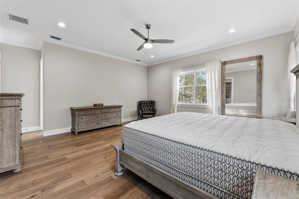 3314 West Villa Rosa Street Tampa, FL 33611 - Photo 17 of 55 a spacious bedroom with a bed and a dresser