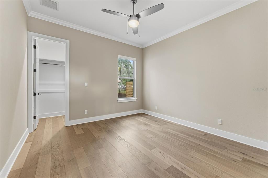 3314 West Villa Rosa Street Tampa, FL 33611 - Photo 21 of 55 wooden floor in an empty room with a window
