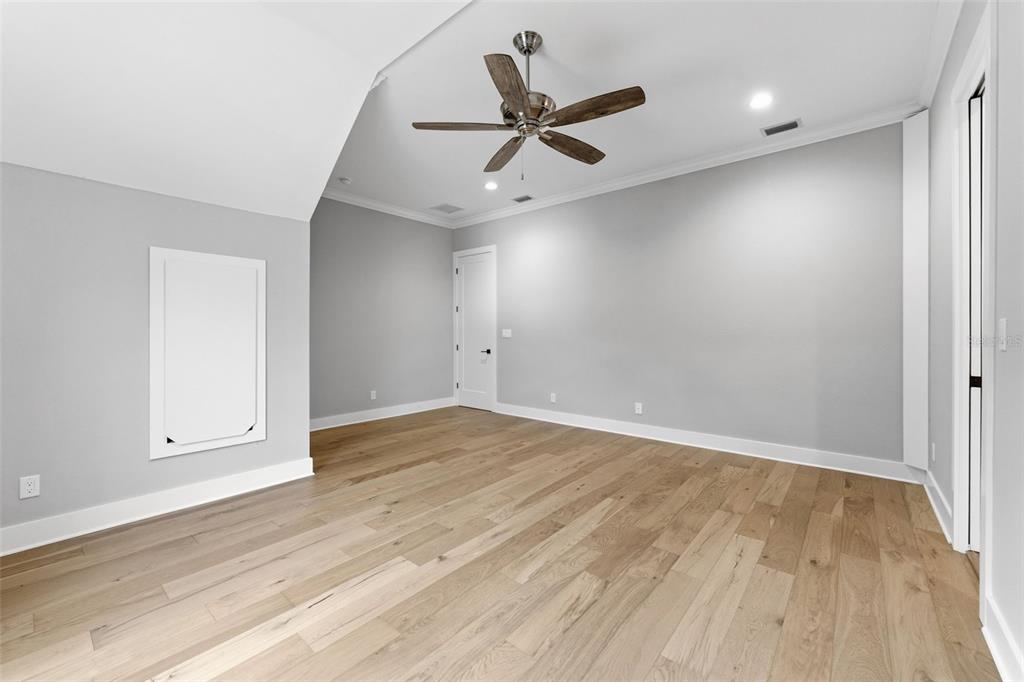 3314 West Villa Rosa Street Tampa, FL 33611 - Photo 26 of 55 an empty room with wooden floor and windows