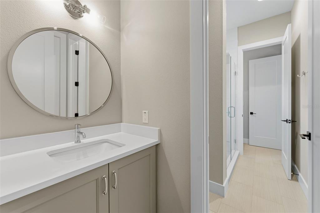 3314 West Villa Rosa Street Tampa, FL 33611 - Photo 33 of 55 a bathroom with a sink a mirror and vanity