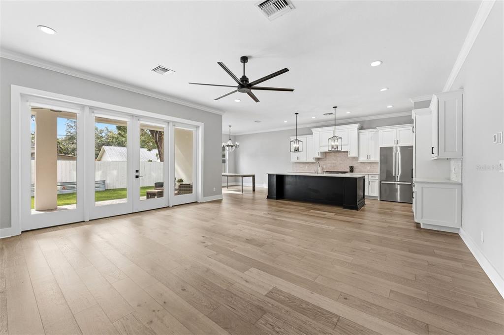 3314 West Villa Rosa Street Tampa, FL 33611 - Photo 5 of 55 a view of a kitchen with a stove cabinets and wooden floor