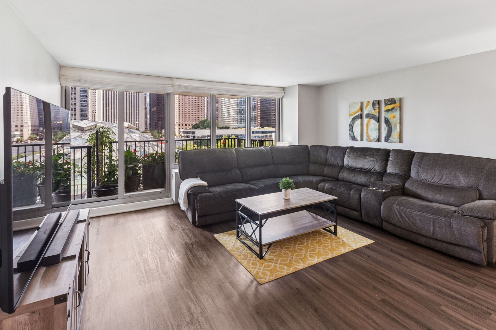 400 East Randolph Street, Unit 930 Chicago, IL 60601 - Photo 3 of 34 a living room with furniture and a wooden floor