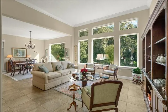 a large kitchen with a table and chairs