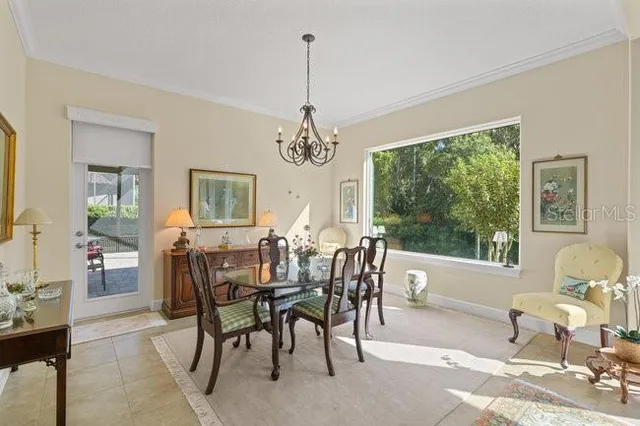 a large kitchen with granite countertop lots of counter space and stainless steel appliances