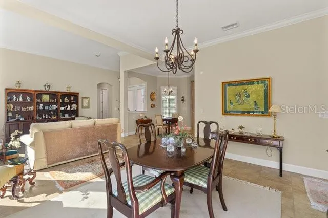 a kitchen with kitchen island granite countertop a sink counter and chairs