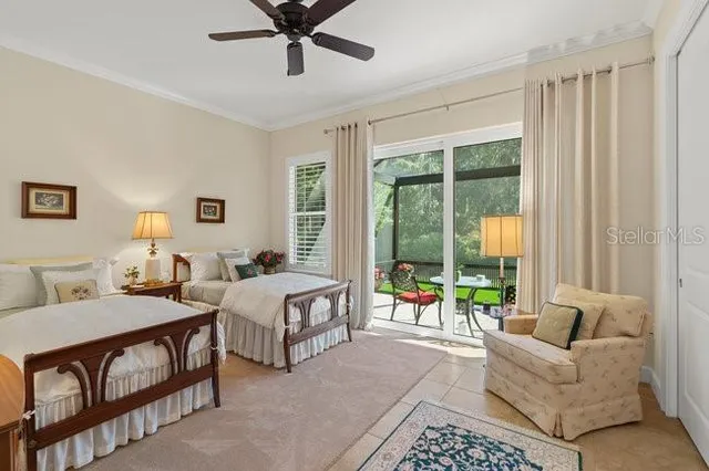 a bathroom with a granite countertop sink and a toilet