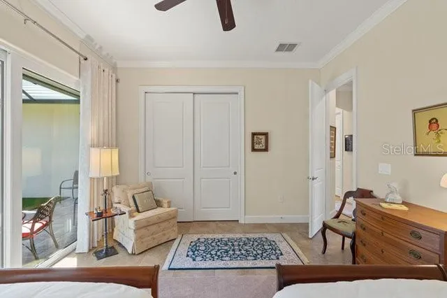 a bedroom with a bed and a table