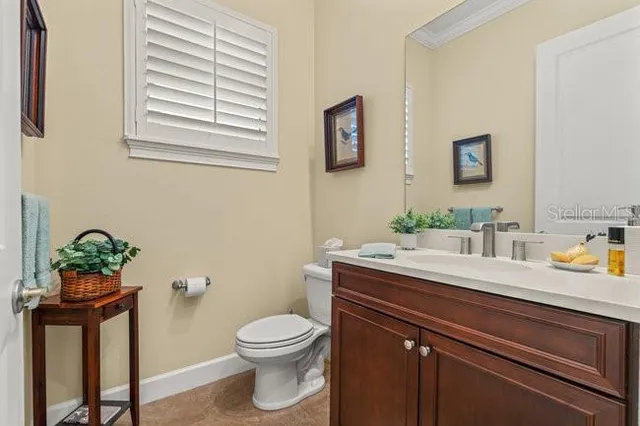 a bathroom with a bathtub sink and mirror