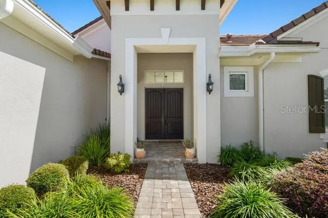 a front view of a house with garden