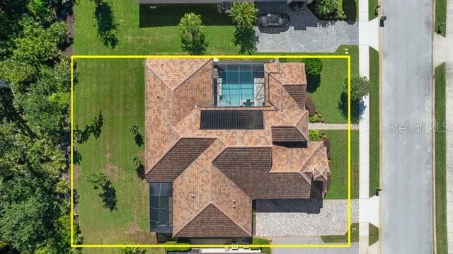 a view of a patio with table and chairs under an umbrella
