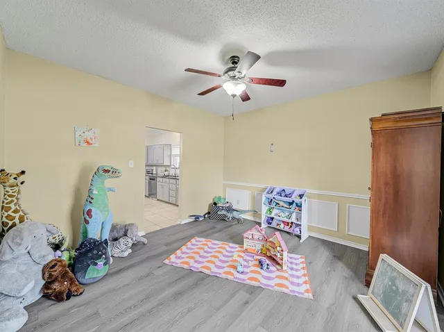 a bedroom with furniture and a chandelier