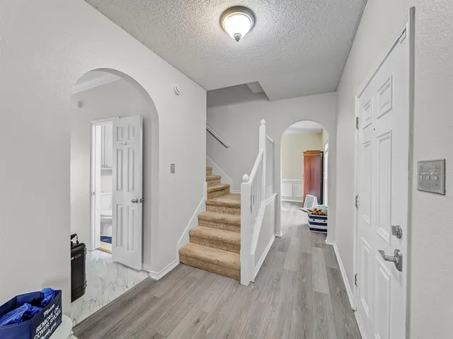 a view of entryway with wooden floor
