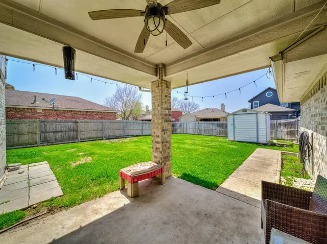 a view of a patio with a yard